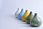 Rice field green speckled round ceramic bud vase